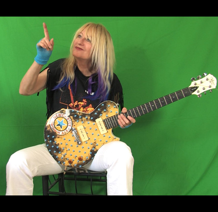 Shredmistress Rynata a Female Guitarist plays the Michael Kelly Guitar